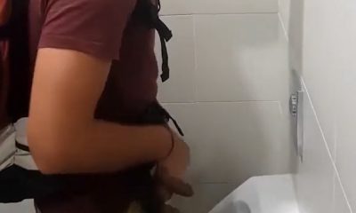 Guy with uncut dick peeing and shaking at the urinal