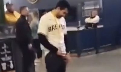 Drunk guy peeing in the middle of baseball stadium