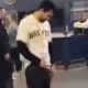 Drunk guy peeing in the middle of baseball stadium