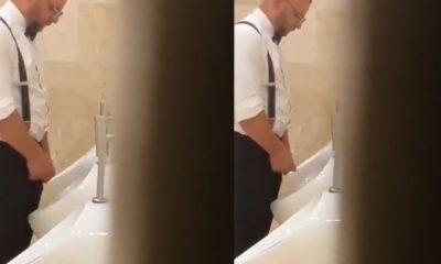 Polish guy in suit caught peeing at urinals during wedding