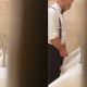 Polish guy in suit caught peeing at urinals during wedding