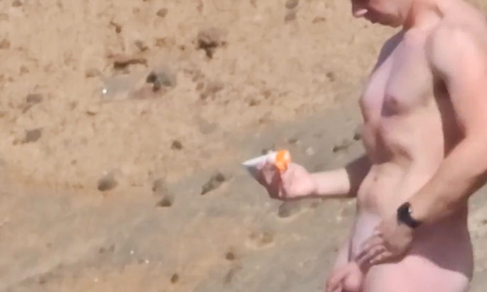 Ginger guy caught naked at the nudist beach