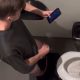 spying overstall on guy wanking in public toilet