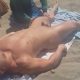 stud captured on video while he gets a massage at the nudist beach