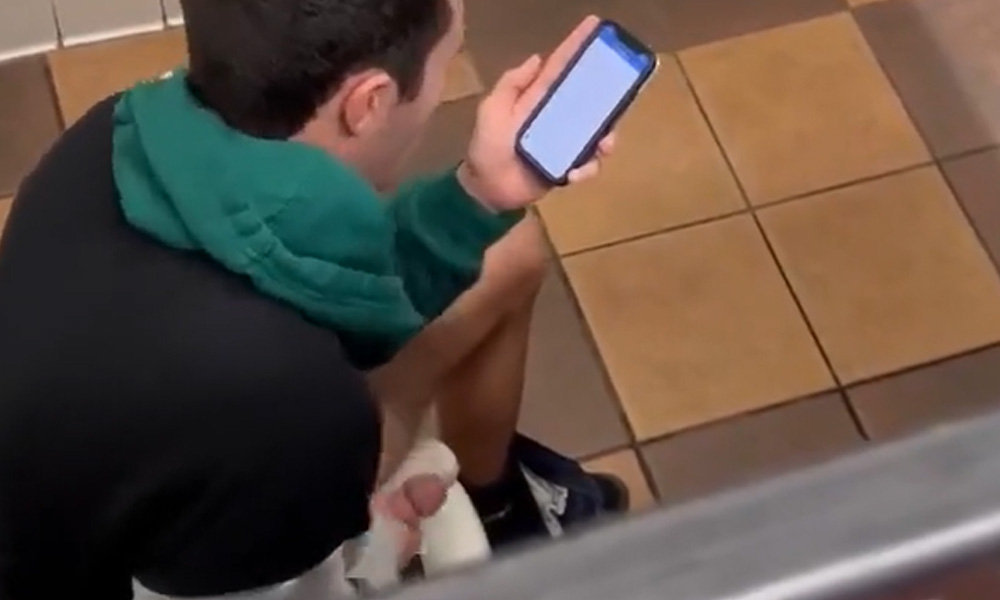 dude wanking his hard cock in a public toilet